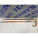 2 WALKING STICKS ONE WOTH BRASS DUCK HEAD HANDLE WHICH SCREWS OFF TO REVEAL GLASS SPIRIT FLASK,