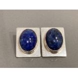 SILVER BLUE STONE CLIP ON EARRINGS FEATURING 2 OVAL SHAPED STONES 1 SET IN EACH EARRING SURROUNDED