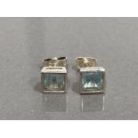 SILVER SQUARE STUDS COMPRISING OF 2 BLUE AQUA COLOURED STONES SET IN A RUB OVER SETTING 1.7G