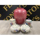 4 HAND PAINTED POOLE POTTERY LIDDED POTS TOGETHER WITH A LARGE PINK POOLE POTTERY BULBOUS VASE