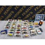 COLLECTION OF VINTAGE DIECAST VEHICLES IN ORIGINAL BOX INCLUDES BUDWEISER, DAYS GONE, BURAGO AND A