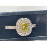 NATURAL FANCY VIVID YELLOW DIAMOND RING 0.50CT CUSHION CUT IN PLATINUM WITH 2 LEVEL DIAMOND HALO IGI