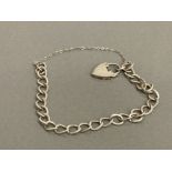 SILVER LADIES CHARM BRACELET COMPLETE WITH PADLOCK AND SAFETY CHAIN 7.9G