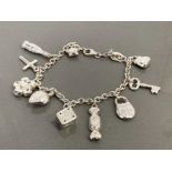 SILVER LADIES CHARM BRACELET WITH ASSORTED CHARMS COMPLETE WITH LOBSTER CATCH 17.9G