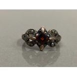 SILVER GARNET AND MARCASITE RING SIZE 3 4.7G GROSS