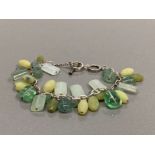 SILVER LINK BRACELET WITH GREEN GEMSTONE CHARMS