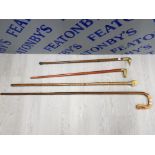 4 WALKING STICKS ONE WITH DUCKS HEAD HANDLE WHICH SCREWS OFF TO REVEAL PLASTIC SPIRIT FLASK,