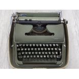 VINTAGE OLYMPIA TYPEWRITER IN CARRY CASE