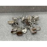 HUGE SILVER ASSORTED CHARM BRACELET 86.3G