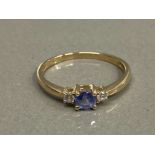 9CT YELLOW GOLD TANZANITE AND CZ 3 STONE RING SIZE N 1.3G GROSS