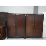 A PAIR OF LARGE STAG MINSTREL WARDROBES