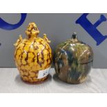 ANTIQUE SLIPWARE MONEY BANK TOGETHER WITH STUDIO POTTERY SLIPWARE BANK WITH APPLIED DOVES AND SIGNED