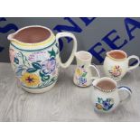 4 VARIOUS POOLE POTTERY HAND PAINTED JUGS WITH BEAUTIFULLY DECORATED FLORAL PATTERNS