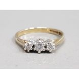 9CT YELLOW GOLD E STONE DIAMOND RING COMPRISING OF 3 BRILLIANT ROUND CUT DIAMONDS SET IN A WHITE