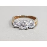 SILVER GOLD PLATED THREE STONE RING COMPRISING OF THREE ROUND CUT CUBIC ZIRCONIAS SET IN CLAW