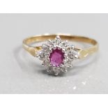 9CT YELLOW GOLD RUBY AND CLUSTER RING FEATURING A OVAL RED STONE IN THE CENTRE SURROUNDED BY 12