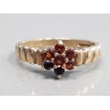 9CT YELLOW GOLD GARNET CLUSTER RING FEATURING 7 GARNET STONES SET IN A CLAW SETTING SIZE M 2.5G