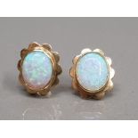 9CT YELLOW GOLD OPAL STUDS SET IN A RUB OVER SETTING WITH FANCY EDGE 2.9G GROSS