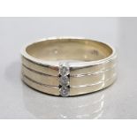 9CT WHITE GOLD DIAMOND RING FEATURING 3 BRILLIANT ROUND CUT DIAMONDS TENSION SET APPROXIMATELY 0.