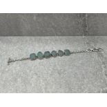 LADIES ORNATE STONE SET BRACELET FEATURING BLUE GLITZY STONES AND T BAR CATCH