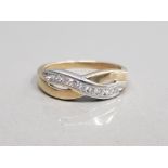 9CT YELLOW GOLD CUBIC ZIRCONIA SET CROSSOVER BAND COMPRISING OF NINE BRILLIANT ROUND CUT CUBIC