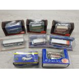 A COLLECTION OF 8 BOXED DIE CAST VEHICLES INCLUDES CORGI BUSSES ETC