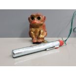 CAST METAL MONKEY ORNAMENT WITH LIGHT UP EYES AND BATTERY PEN ATTACHED