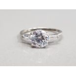 9CT WHITE GOLD CUBIC ZIRCONIA SET RING FEATURING A ROUND CUBIC ZIRCONIA SET IN THE CENTRE WITH