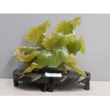 DARK GREEN EAST ASIAN JADE CARVING OF 3 RUNNING HORSES ON STAINED BLACK BASE