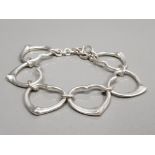 SILVER TIFFANY AND CO HEART LINK BRACELET WITH T BAR CATCH