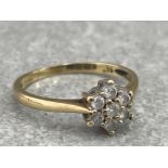 9CT GOLD DIAMOND FLOWER CLUSTER RING COMPRISING SEVEN ROUND BRILLIANT CUT APPROX .33CT 2G SIZE P