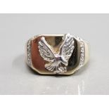 9CT YELLOW GOLD RING SET WITH WHITE GOLD EAGLE ON THE FRONT AND EDGES SET WITH DIAMONDS ALL STONES