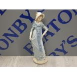 NAO BY LLADRO FIGURE OF A LADY WEARING LONG BLUE DRESS AND BONNET SAS