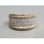 9CT YELLOW GOLD DIAMOND SET THREE ROW TURBAN STYLE BAND COMPRISING OF THRIRTY BRILLIANT ROUND CUT