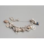 SILVER CHARM BRACELET WITH ASSORTED CHARMS 83.3G GROSS