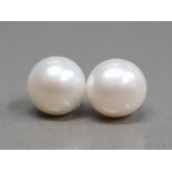 A PAIR OF LARGE CULTURED PEARL STUD EARRINGS ON SILVER POSTS