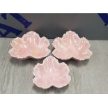 A SET OF THREE STUDIO POTTERY GLAZED LEAF DISHES SIGNED AND DATED IRENE 1990