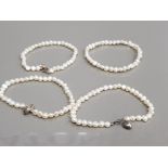 FOUR FRESHWATER PEARL BRACELETS 3 WITH SILVER FITTINGS