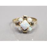 14CT YELLOW GOLD OPAL CLUSTER RING COMPRISING OF A PRINCESS CUT OPAL IN THE CENTRE SET WITH FOUR