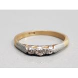 18CT YELLOW GOLD DIAMOND RING COMPRISING OF 3 DIAMONDS IN A CONTRAST SETTING POSSIBLY PLATINUM