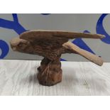 CAST IRON FIGURE OF A HAWK ABOUT TO TAKE OFF