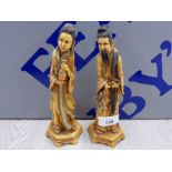 A PAIR OF VINTAGE ORIENTAL RESIN FIGURES OF A MAN AND A WOMAN