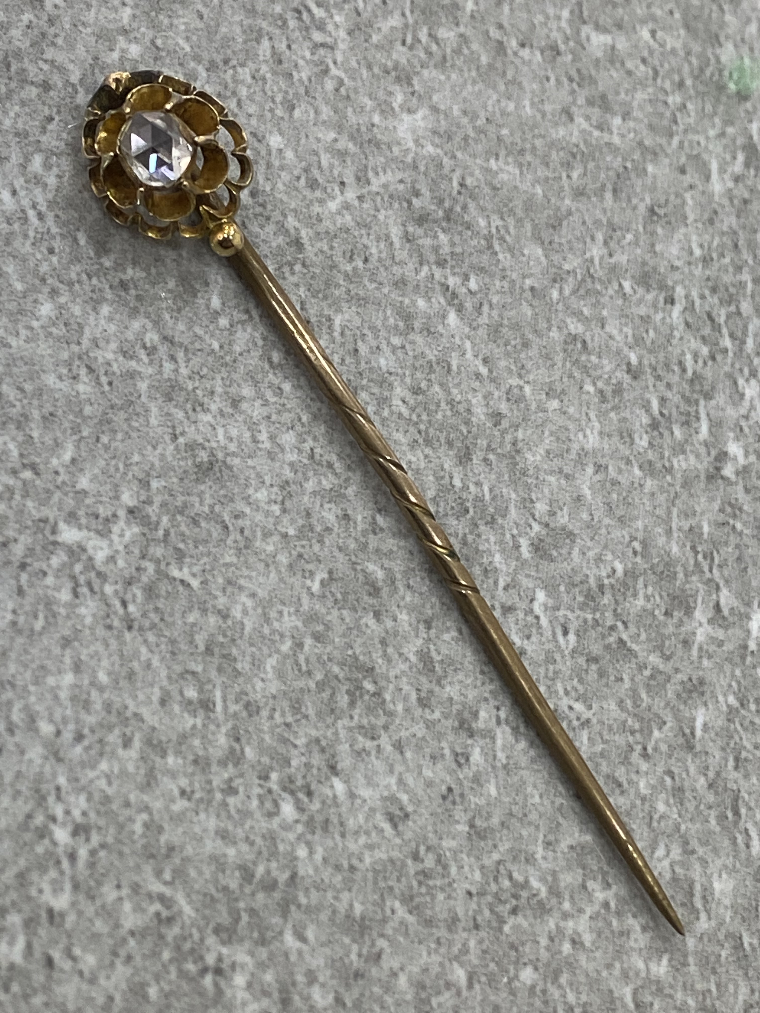 ANTIQUE GOLD DIAMOND TIE PIN COMPRISING OF A ROSE CUT DIAMOND SET IN ORNATE SETTING APX .25CT 1.8G