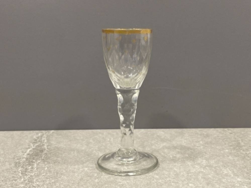 GEORGIAN C1800 DRINKING GLASS FACET CUT STEM AND BOWL APPLIED GILT EDGE FLEUR DE LIS TO BOWL CONICAL
