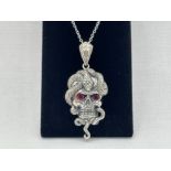 SILVER SKULL PENDANT WITH RUBILITE EYES AND CHAIN 43CM IN LENGTH PENDENT 4CM IN LENGTH