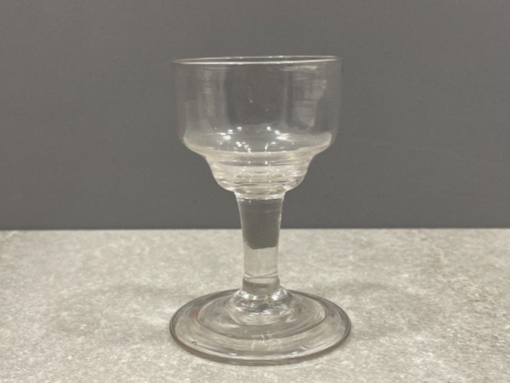 18TH CENTURY DRINKING GLASS PLAIN DOUBLE OGEE BOWL ON PLAIN STEM AND SEMI CONICAL FOLDED FOOT BASE