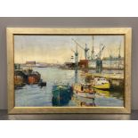 FRAMED OIL ON BOARD TITLED A VIEW OF A SHIPYARD WITH BOATS MOORED NEARBY, SIGNED BY THE ARTIST