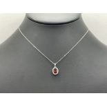 18CT WHITE GOLD GARNET DIAMOND PENDANT AND CHAIN 39CM IN LENGTH