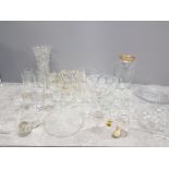 A LARGE QUANTITY OF GLASSWARE INCLUDES VASES DRINKING GLASSES PERFUME BOTTLES ETC
