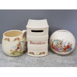 2 ROYAL DOULTON BUNNYKINS COMMEMORATIVE MONEY BOXES AND A BUNNYKINS BEAKER